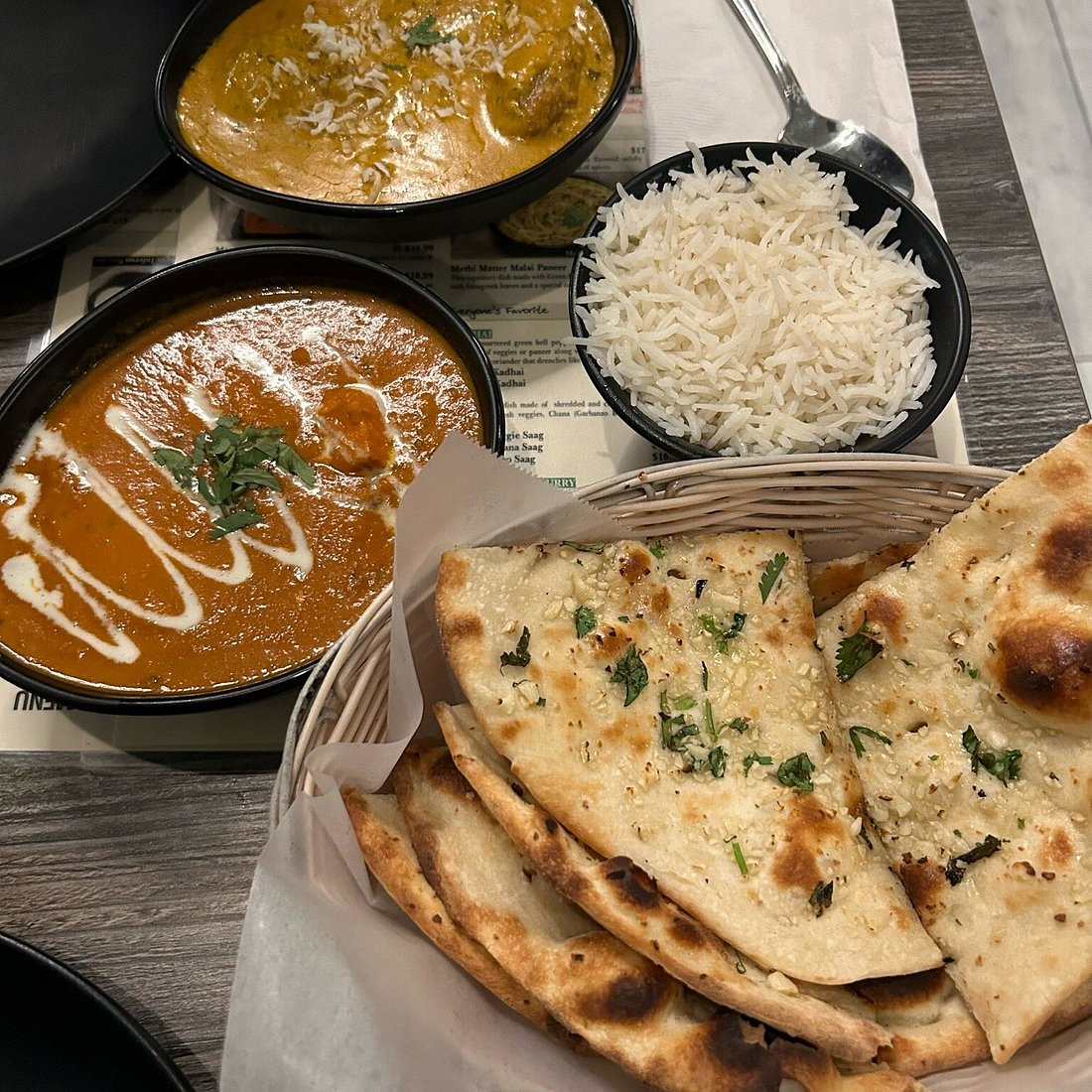 Mint Indian Bistro signature dishes Lamb VindalooGobi ManchurianGarlic Naan